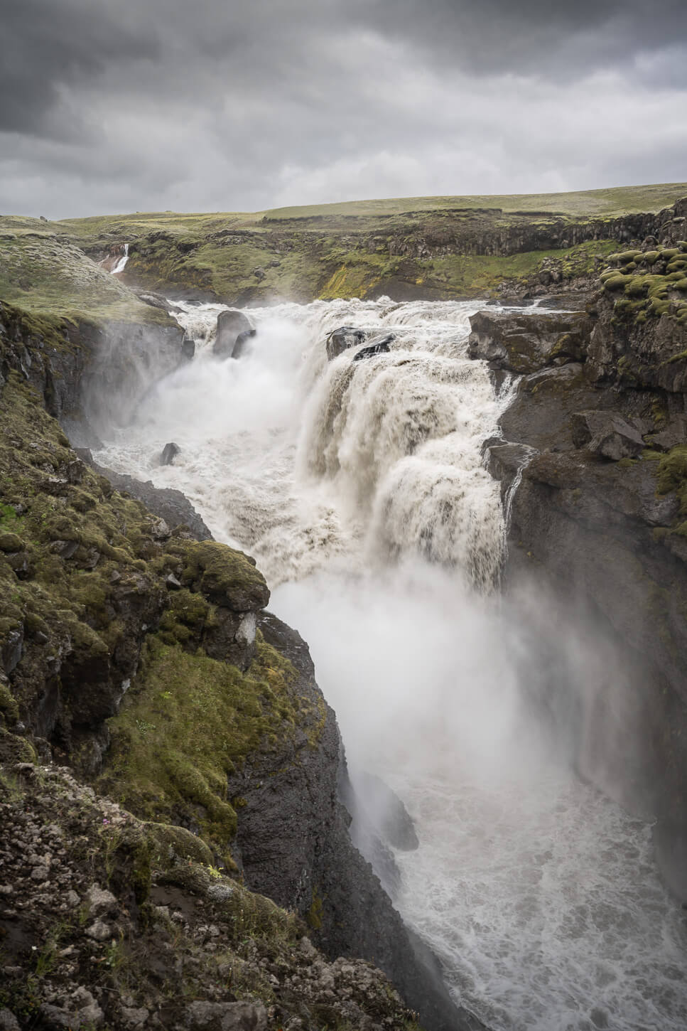 A powerful waterfall called Lambhagafoss in a glacial river in south Iceland.