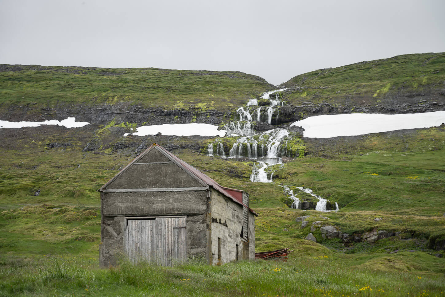 Waterfall and Abandoned Barn in the Westfjord of Iceland