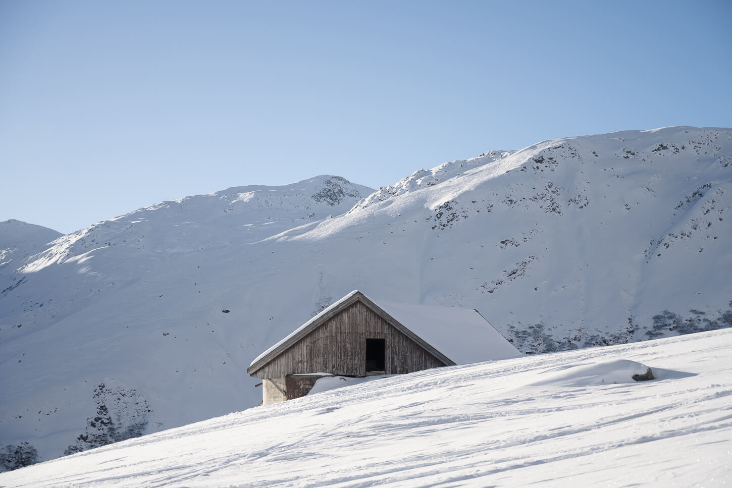Mountain hut in Winter.