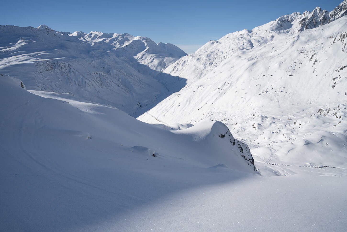 Pristine view of a snow-covered alpine landscape in Switzerland near the Furka Pass.