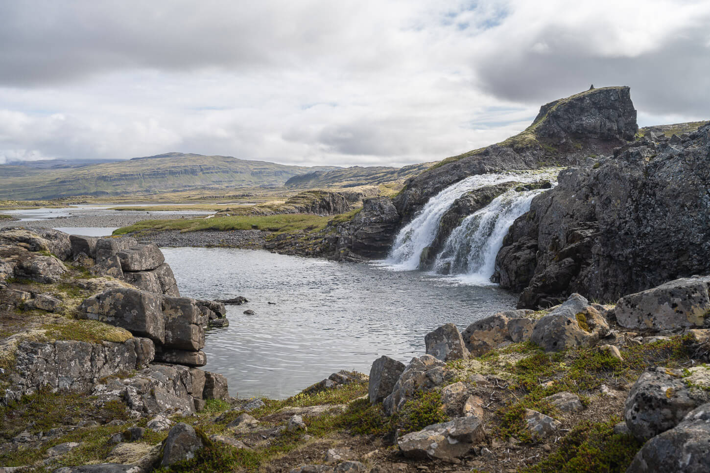 Hivalarfoss Waterfall in the westfjord third waterfall on a scenic hike.