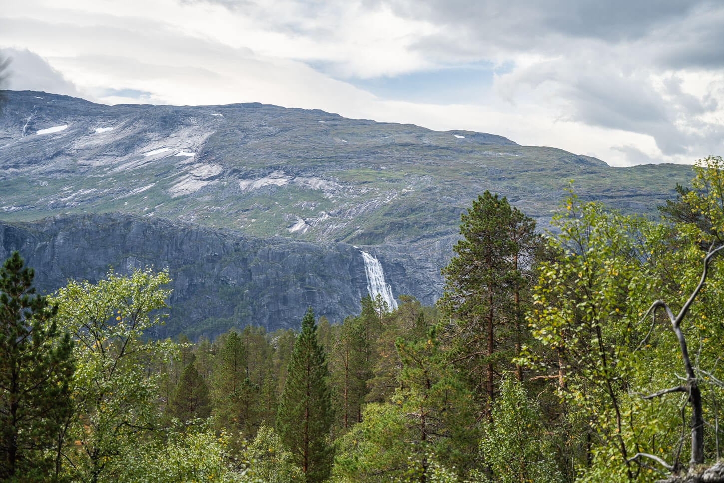 View of Litlverivassforsen from a distance from a nearby hiking trail.