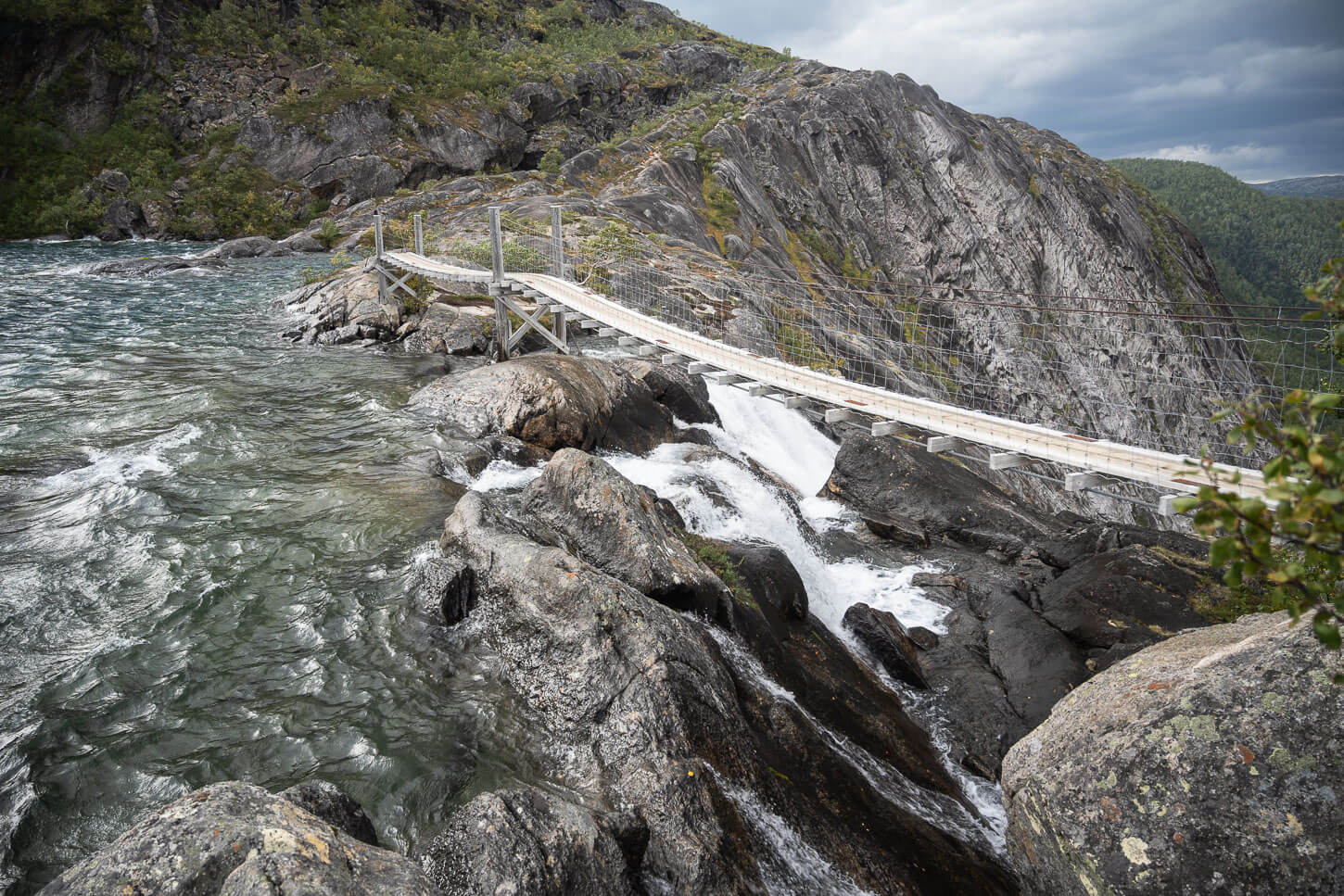 Litlverivassforsen suspension bridge above the waterfall.