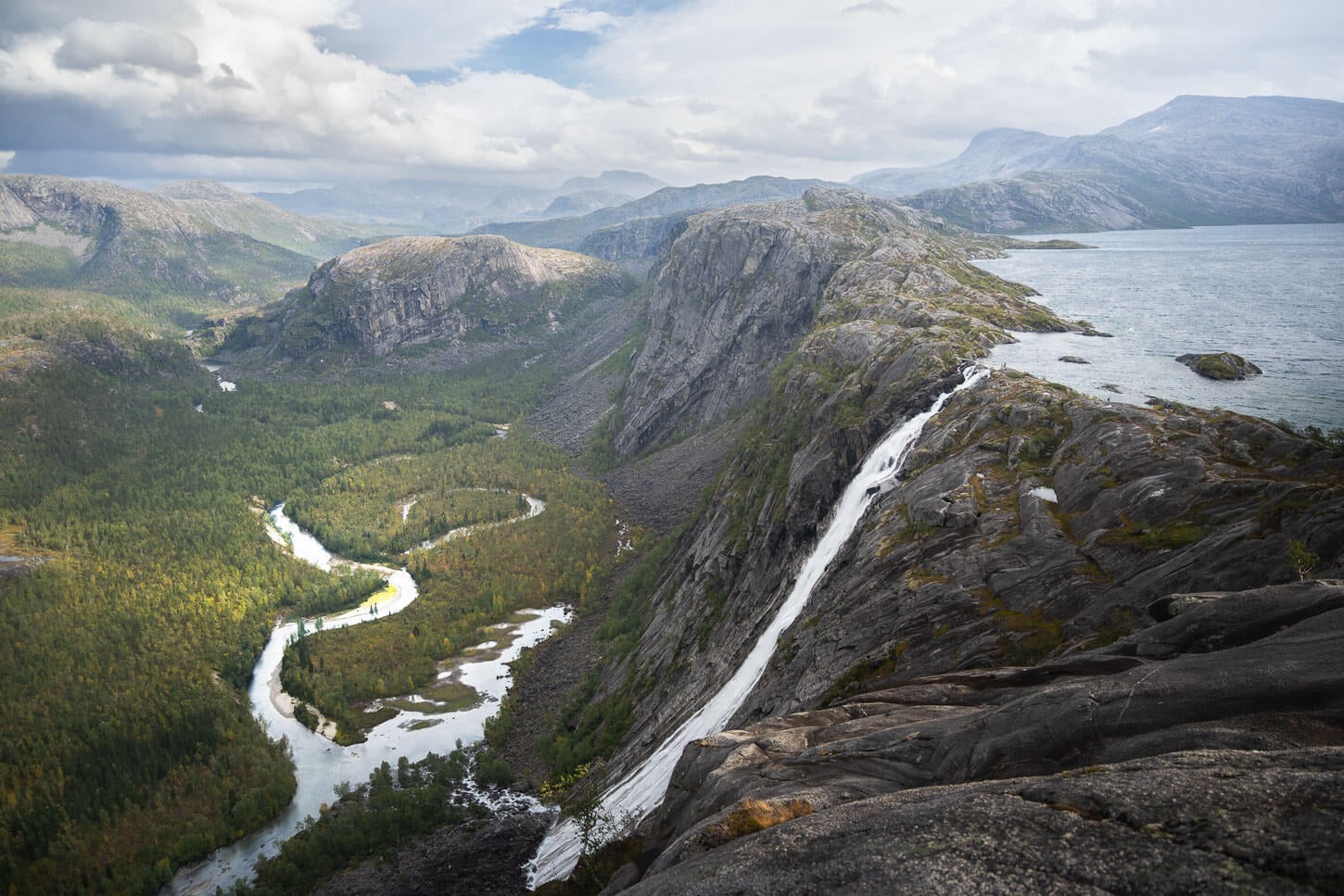 Litlverivassforsen on a cloudy day, with the beautiful, pristine environment of the Rago National Park.