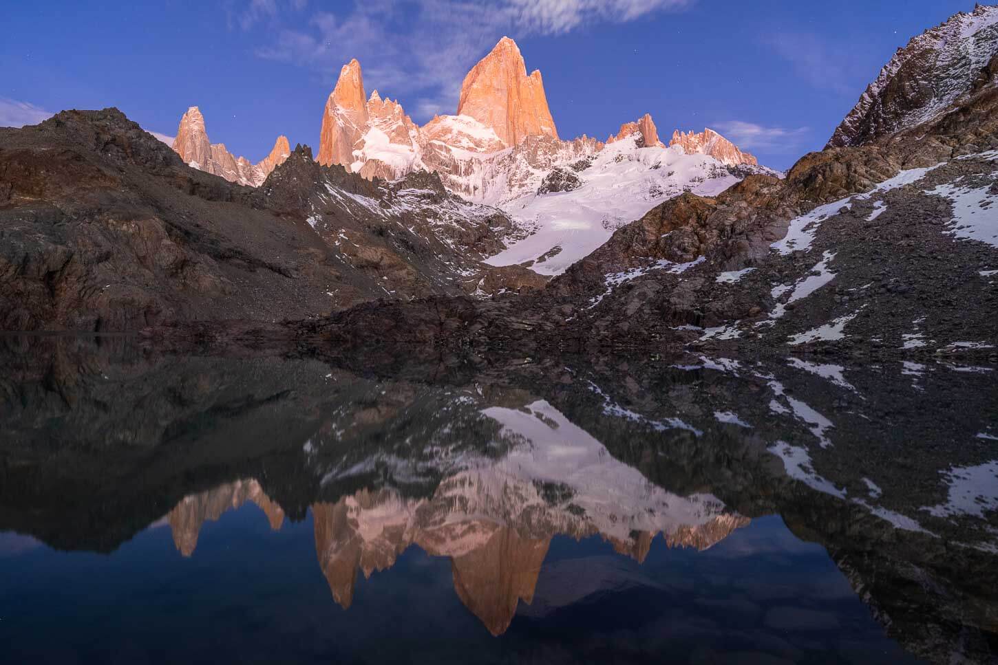 Twilight light on Mount Fitz Roy, with its reflection in Laguna de los tres.
