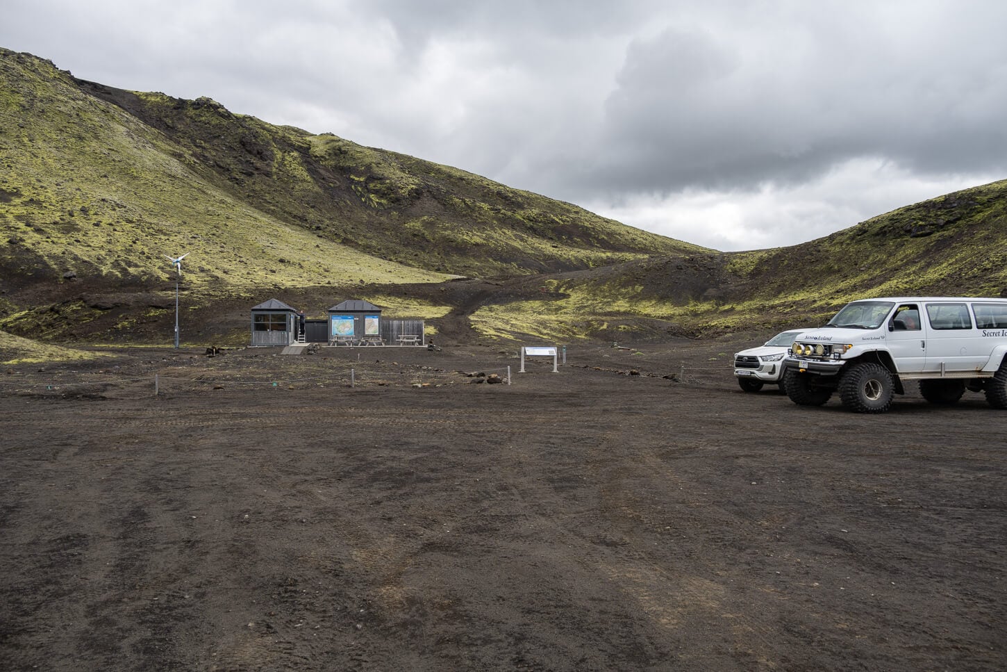 Laki Craters parking area and visitors center with a few vehicles parked by the trailhead