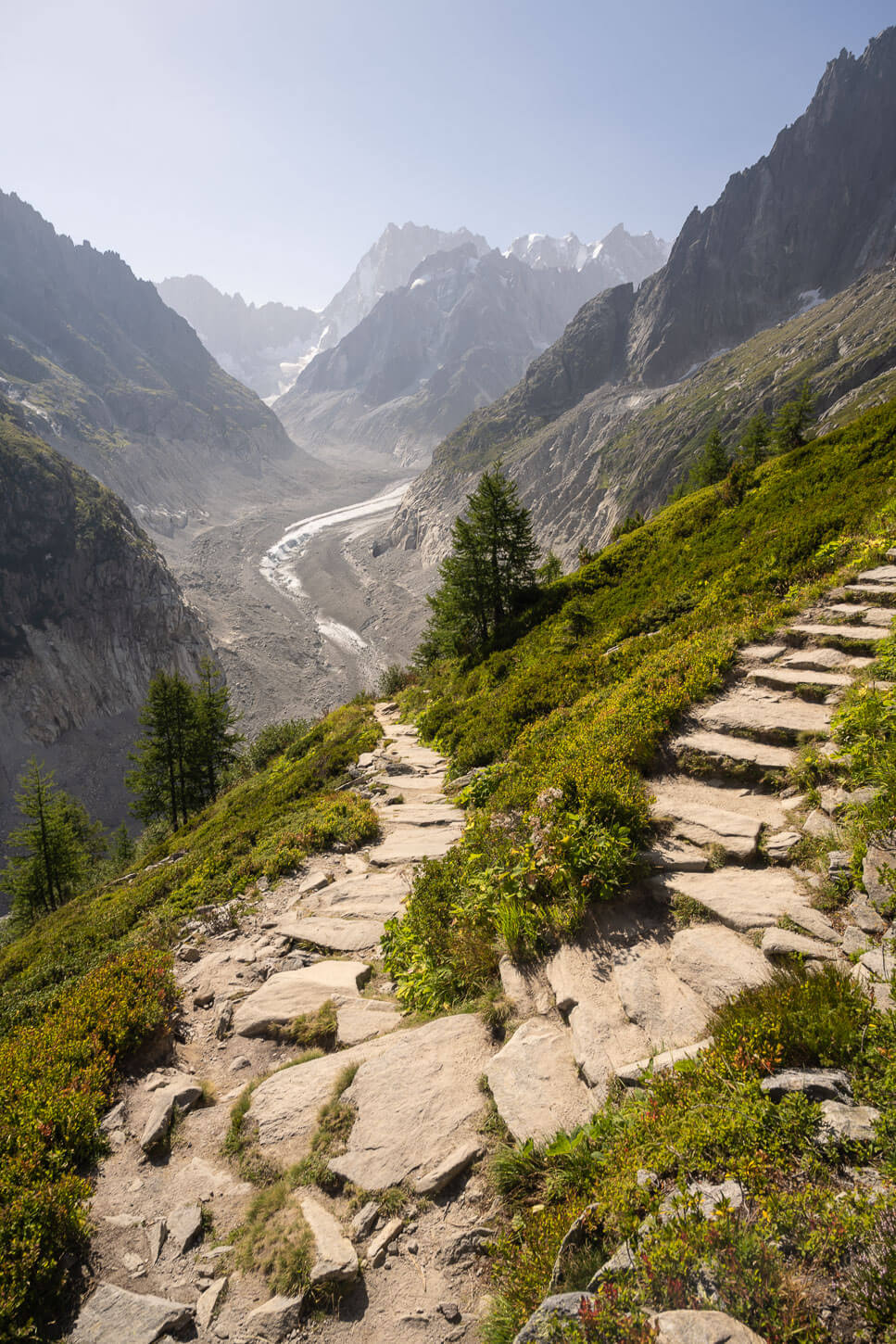 section of the Grand Balcon Nord trail above Mer de Glace, with the glacier and jagged mountains in the background.