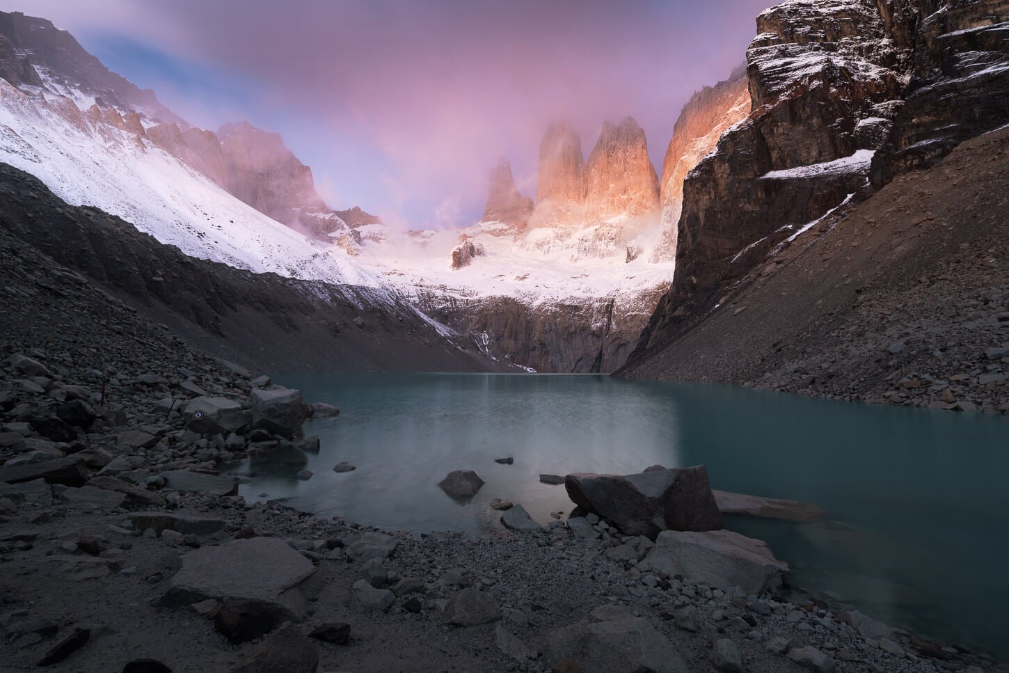 View of the Base Torres as Sunrise Hike with the first warm light of the day lighting the towers.
