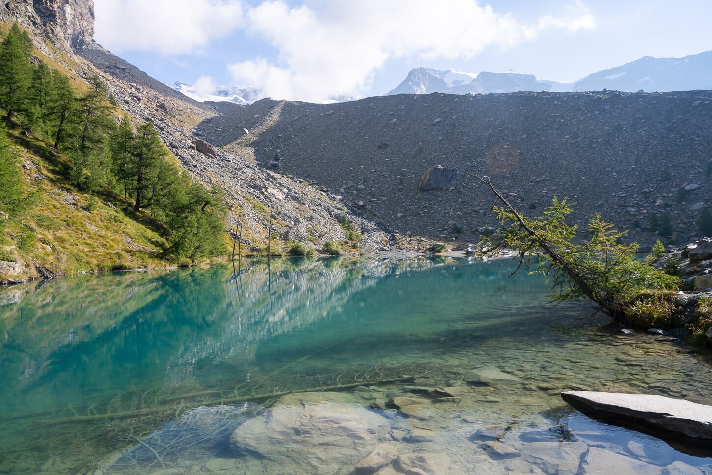 Lago Blu in Val d'Ayas, with its deep blue waters at the bottom of a morainic deposit.