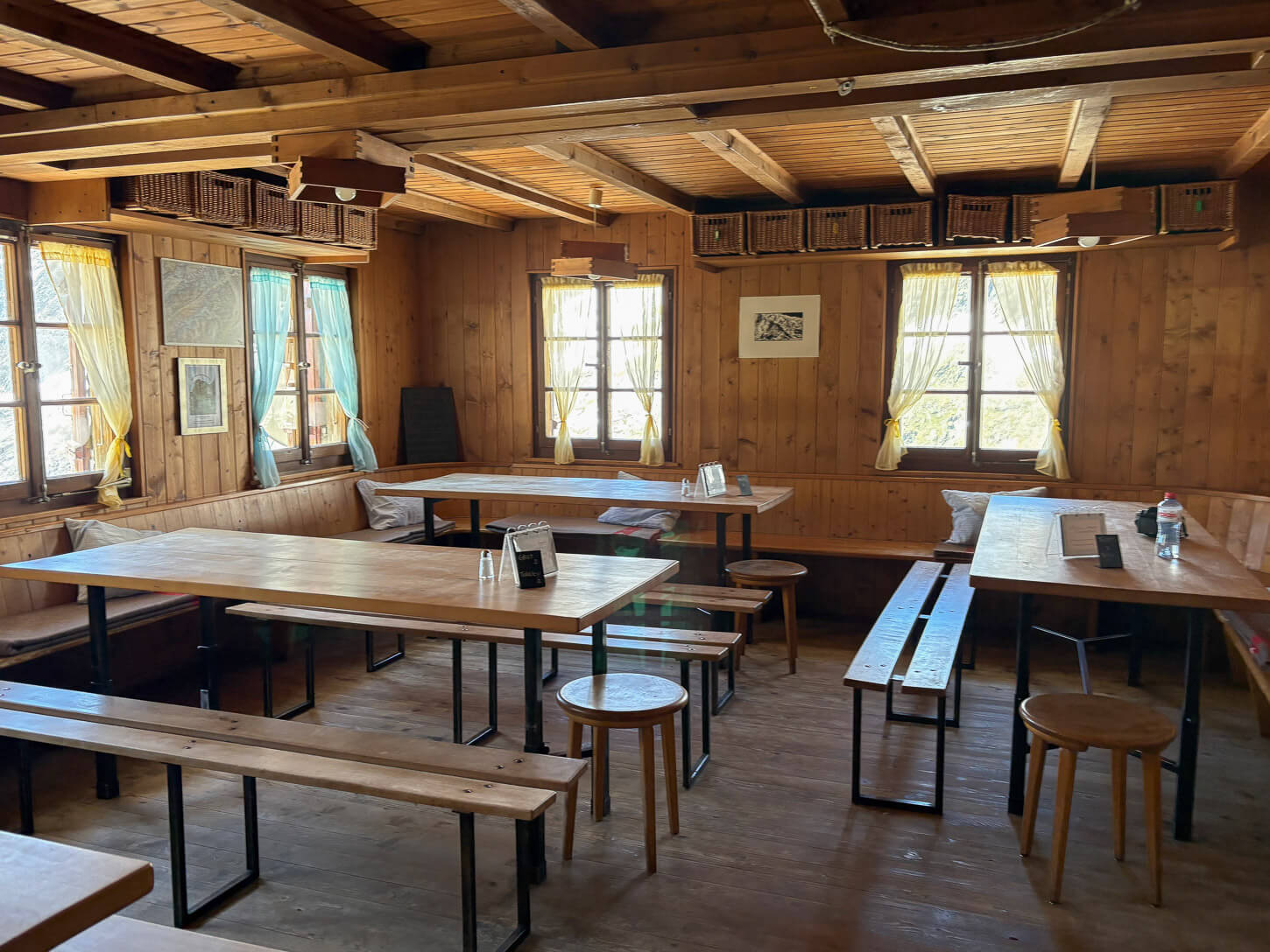 Inside the Oberaletschhütte, a typical welcoming wooden structure with communal tables