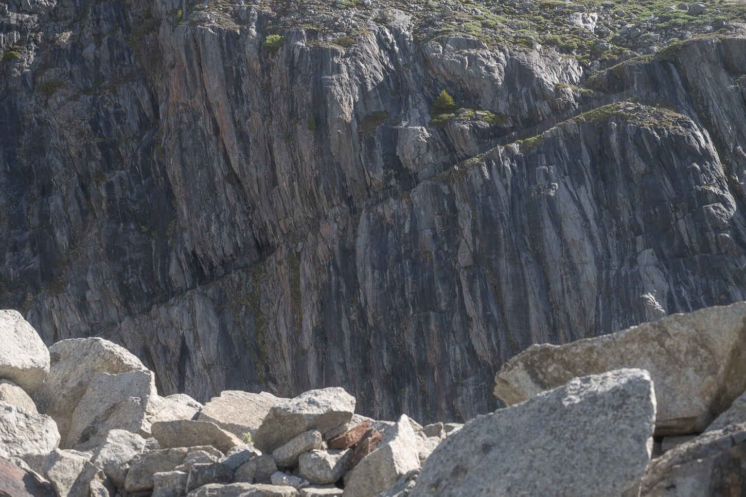 view of a trail carved on a steep moutainside.