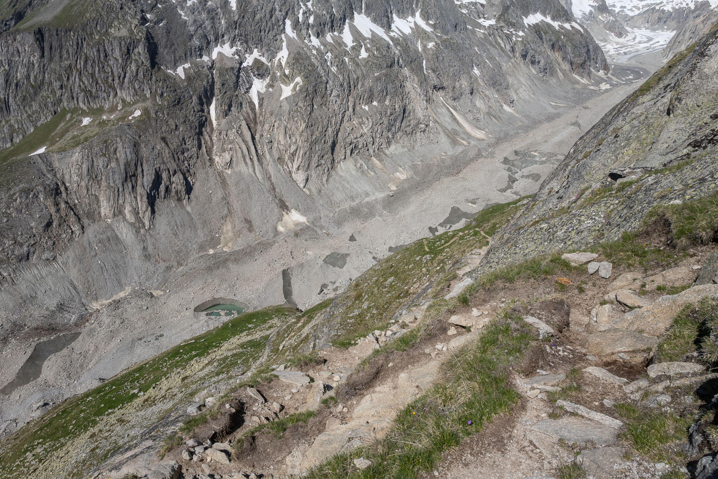 Steep winding trail above the oberaletsch valley, with the glacier in the background, part of the Hike to the Oberaletsch Hut.