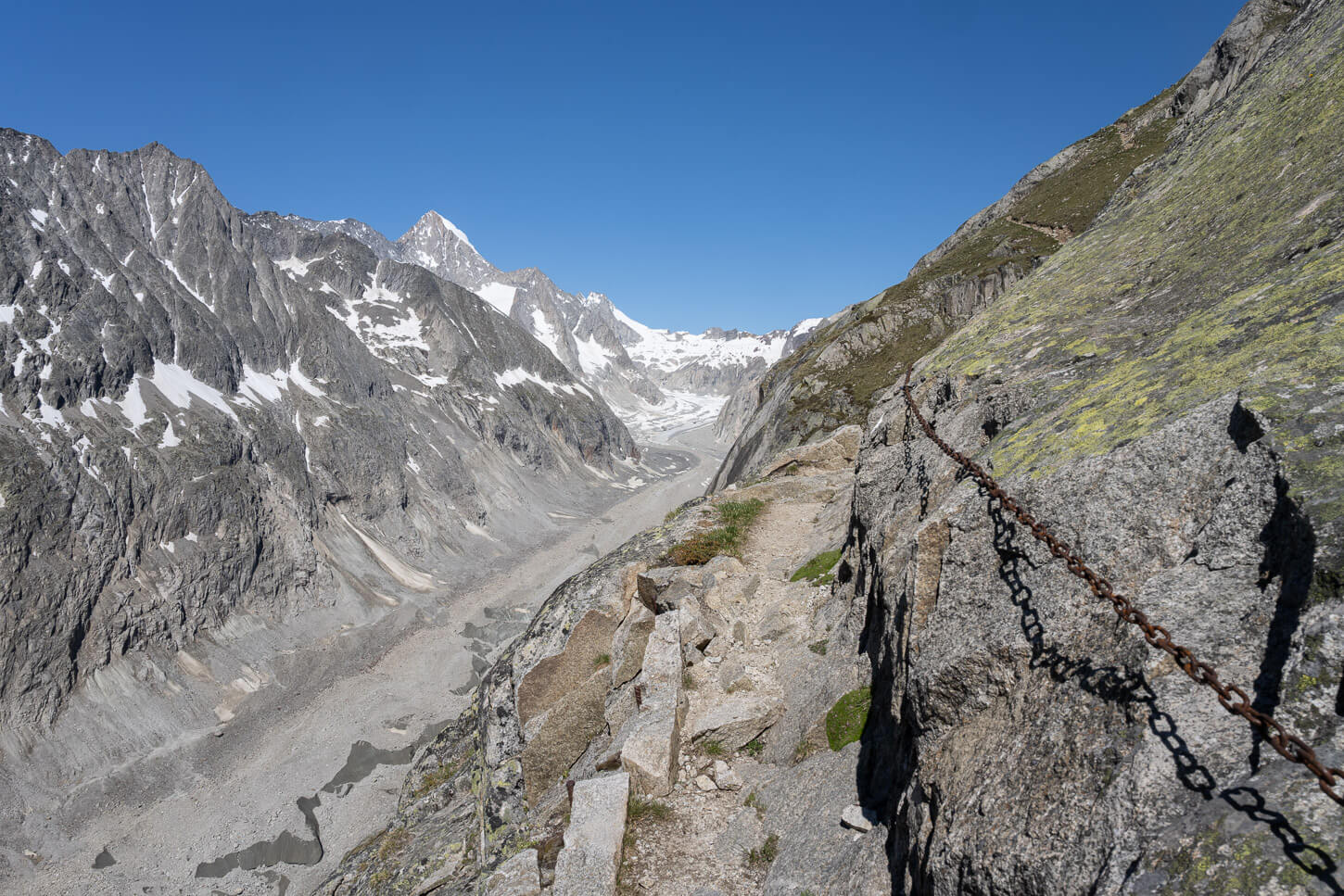 Oberaletsch Panoramaweg trail to the Oberaletsch hut, with chains installed on a moderately exposed section of the hike.