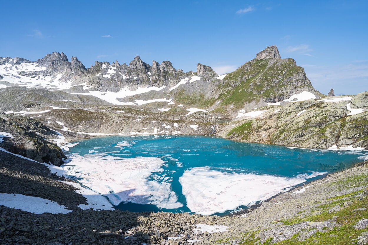 Wildesse the second lake on the Pizol five lakes hike, with ice floating in its rich turqoise waters