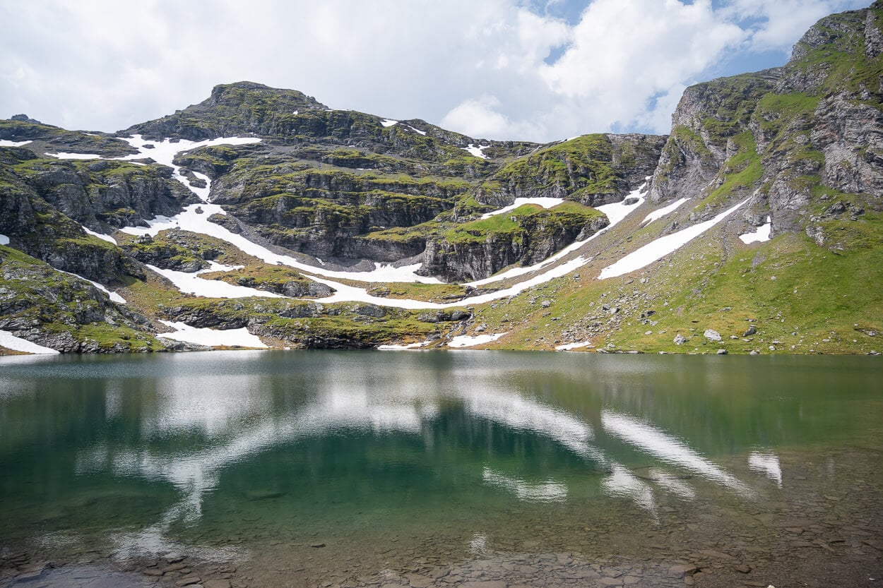 Landscape refelcting In Schwarzsee on the Pizol filve lakes trail