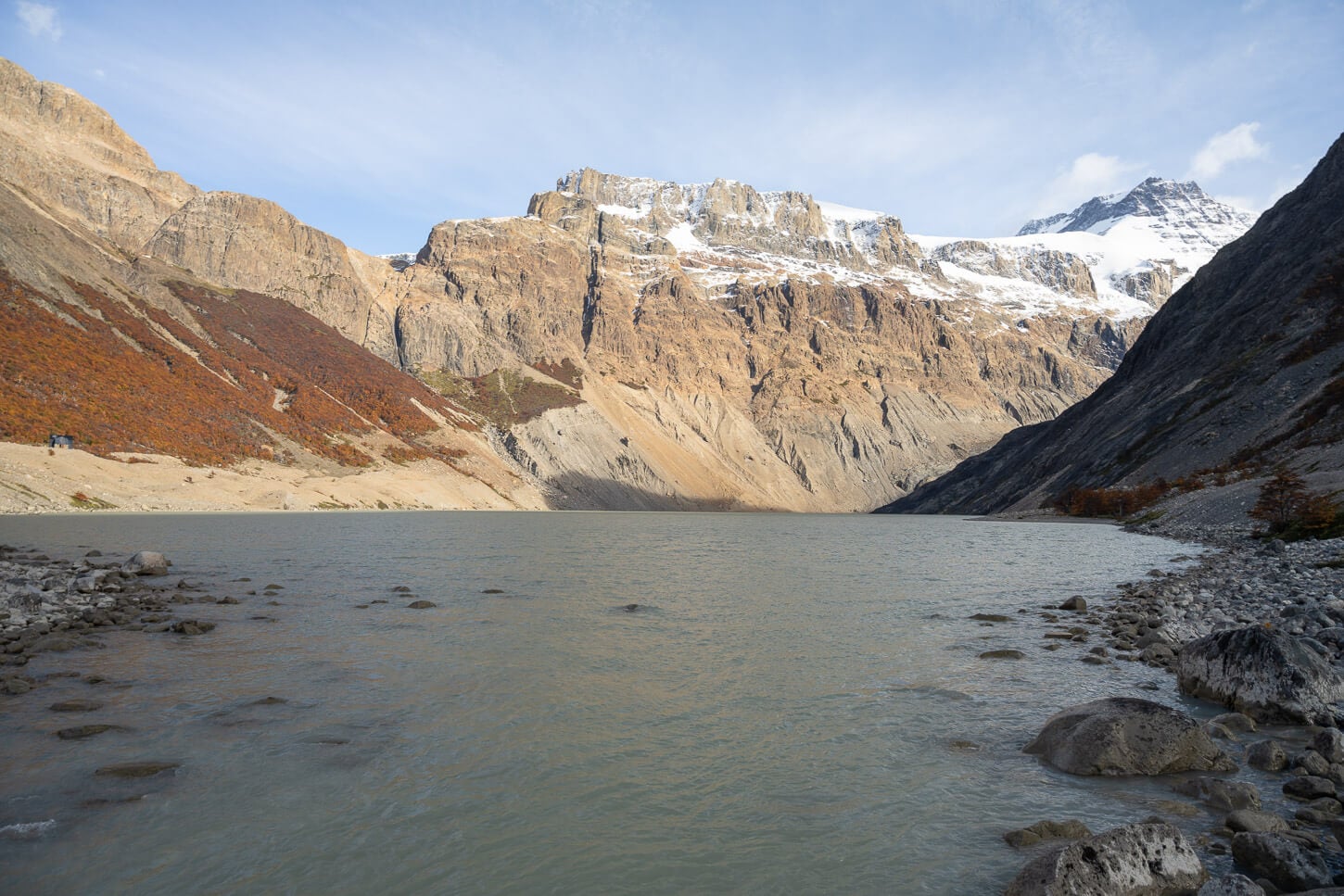 Shores of Laguna Diablo, with the mountains in the background and the mineral-rich glacial waters of the lake in the foreground.