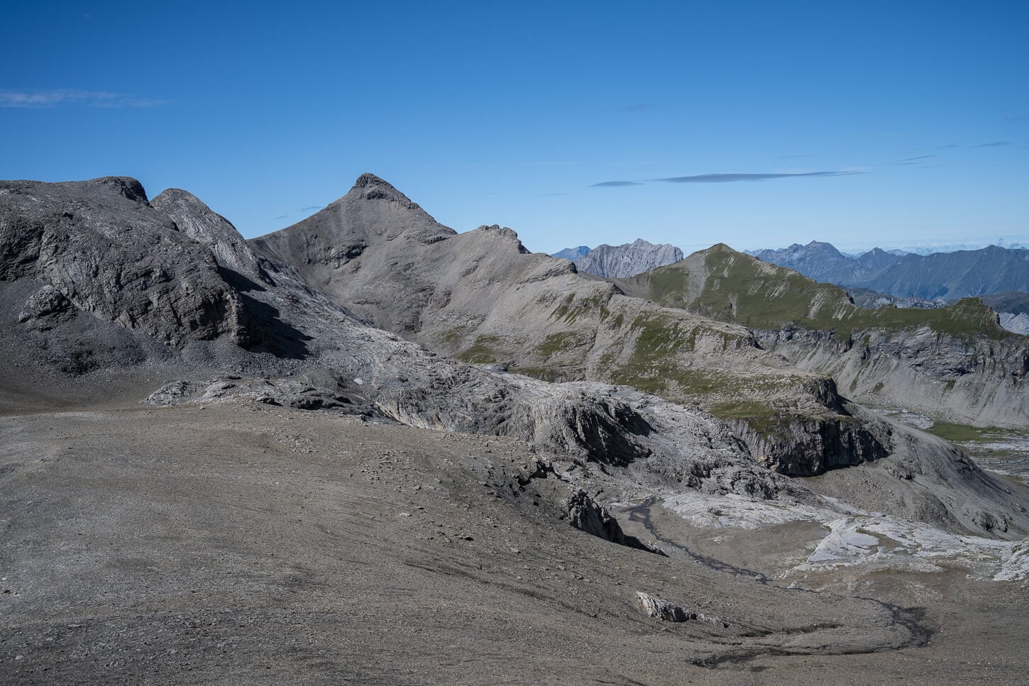 Lunar-like landscape covered in scree on a high-plateau in the mountains.