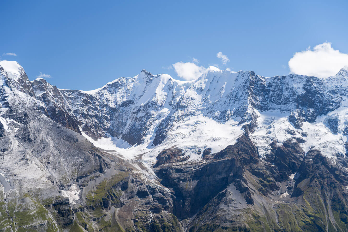View of glacier and mountains of the Lauterbrunen valley, under the bright light of a suny summer day.
