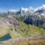 Epic Landscape photo from a Hike to Schiltorn with the green Lauterbrunnen Valley below the towering peaks of the Eiger, the Mönch, and the Jungfrau.