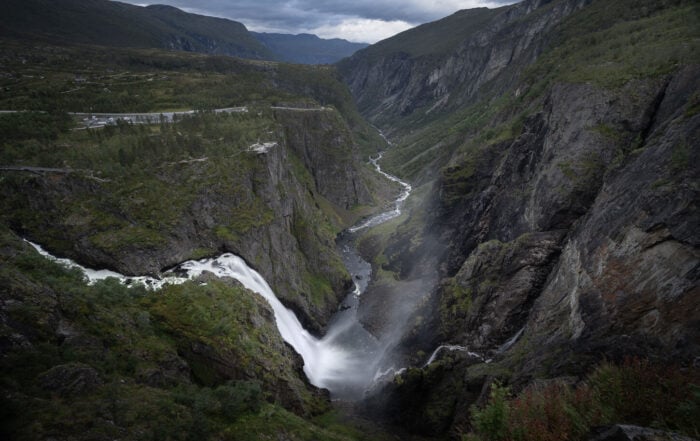 Moody image of Vøringsfossen in a photo taken from the main viewpoint along the hike on the new walkway around the waterfall.