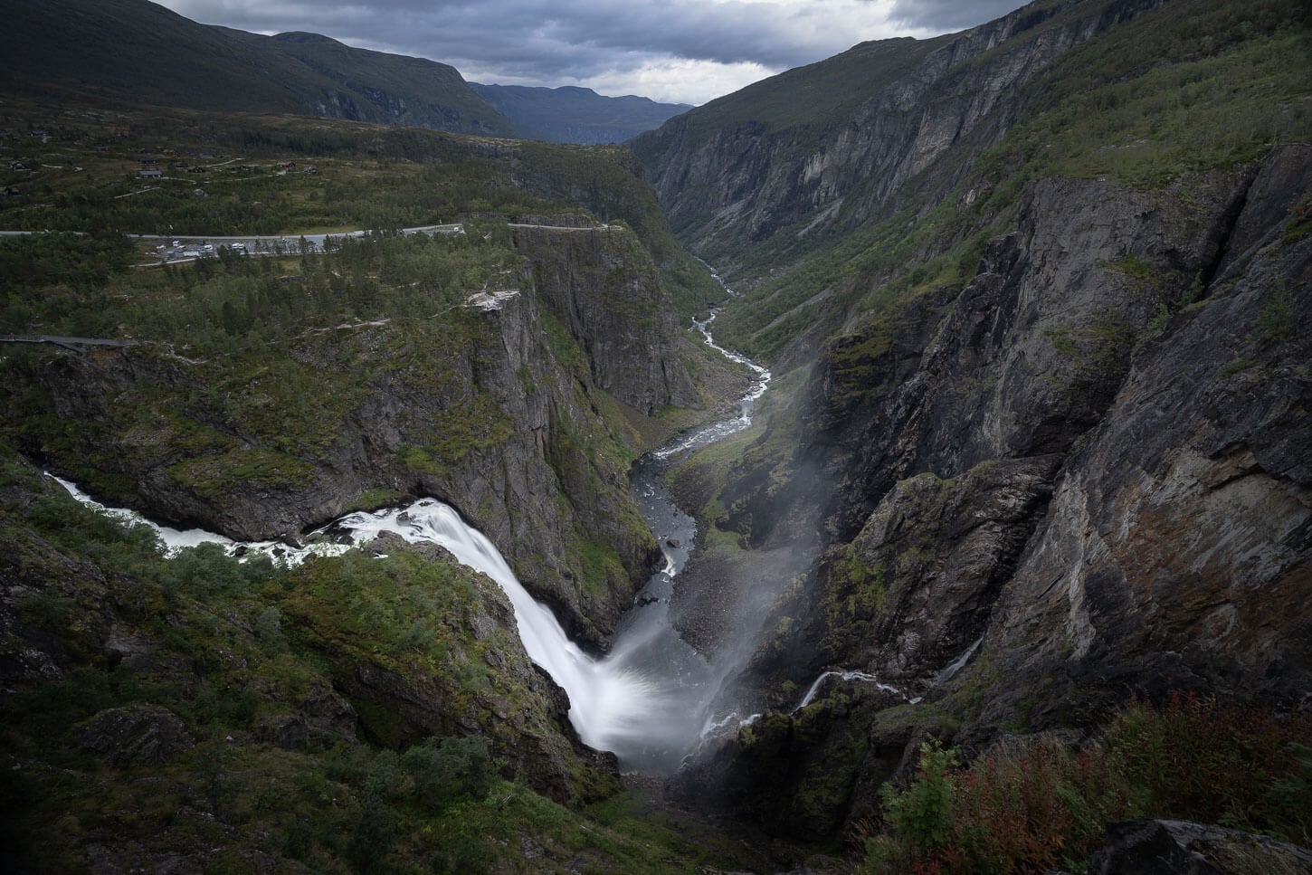 Moody image of Vøringsfossen in a photo taken from the main viewpoint along the hike on the new walkway around the waterfall.