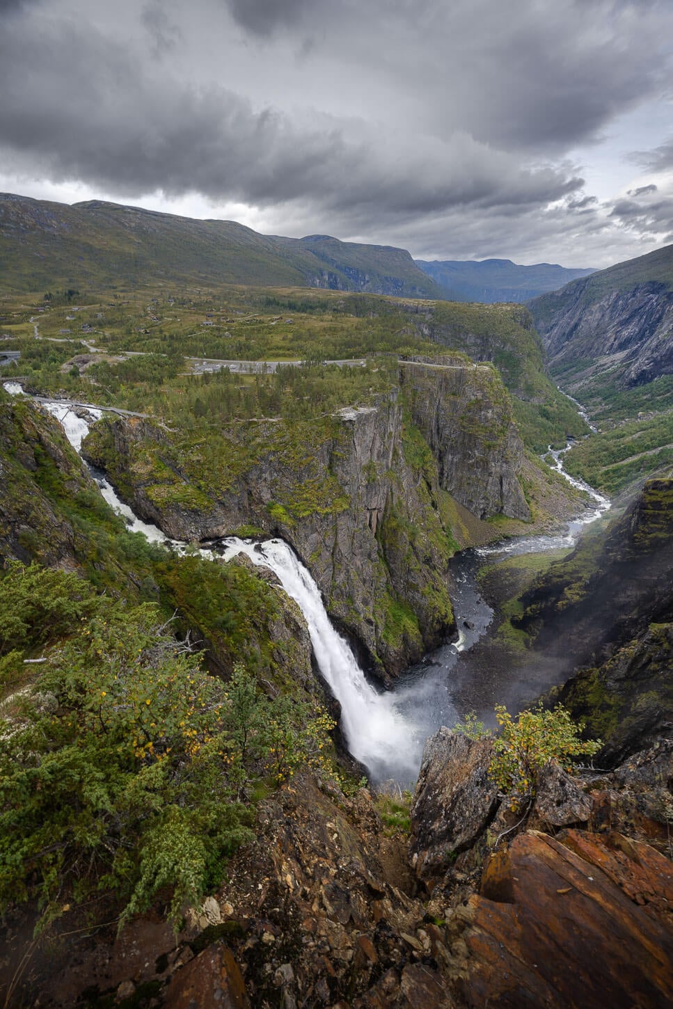 Vøringsfossen under a dark and menacing sky.