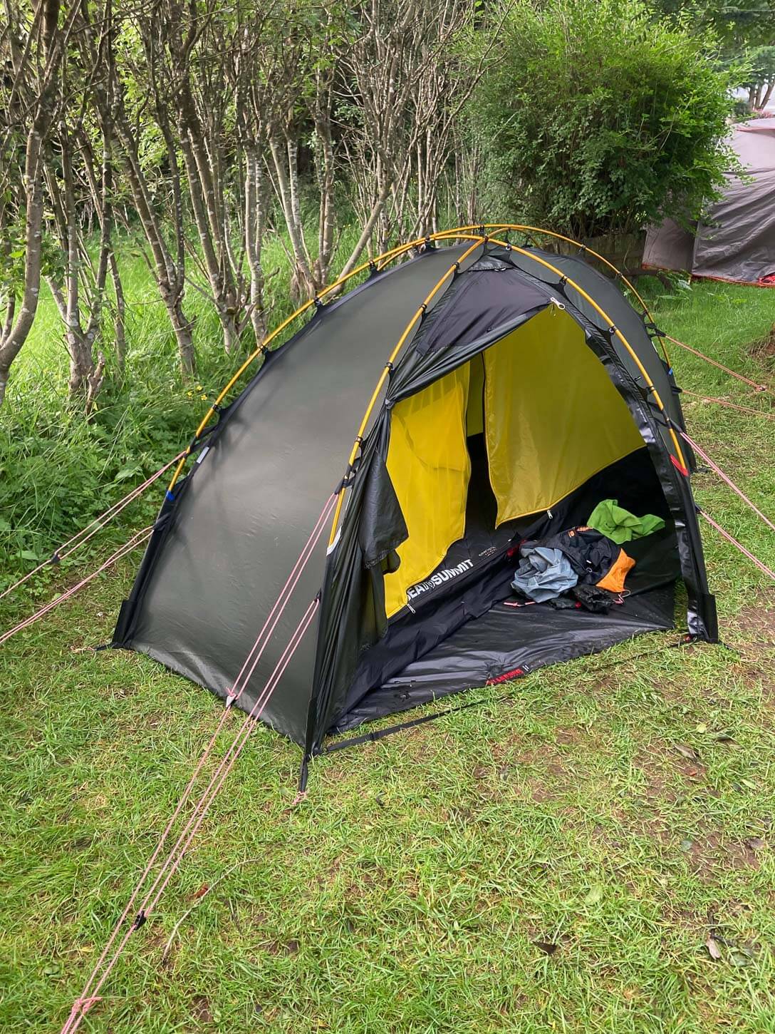 Opened Hilleberg Soulo showing the vestibule area as storage space, with some items.