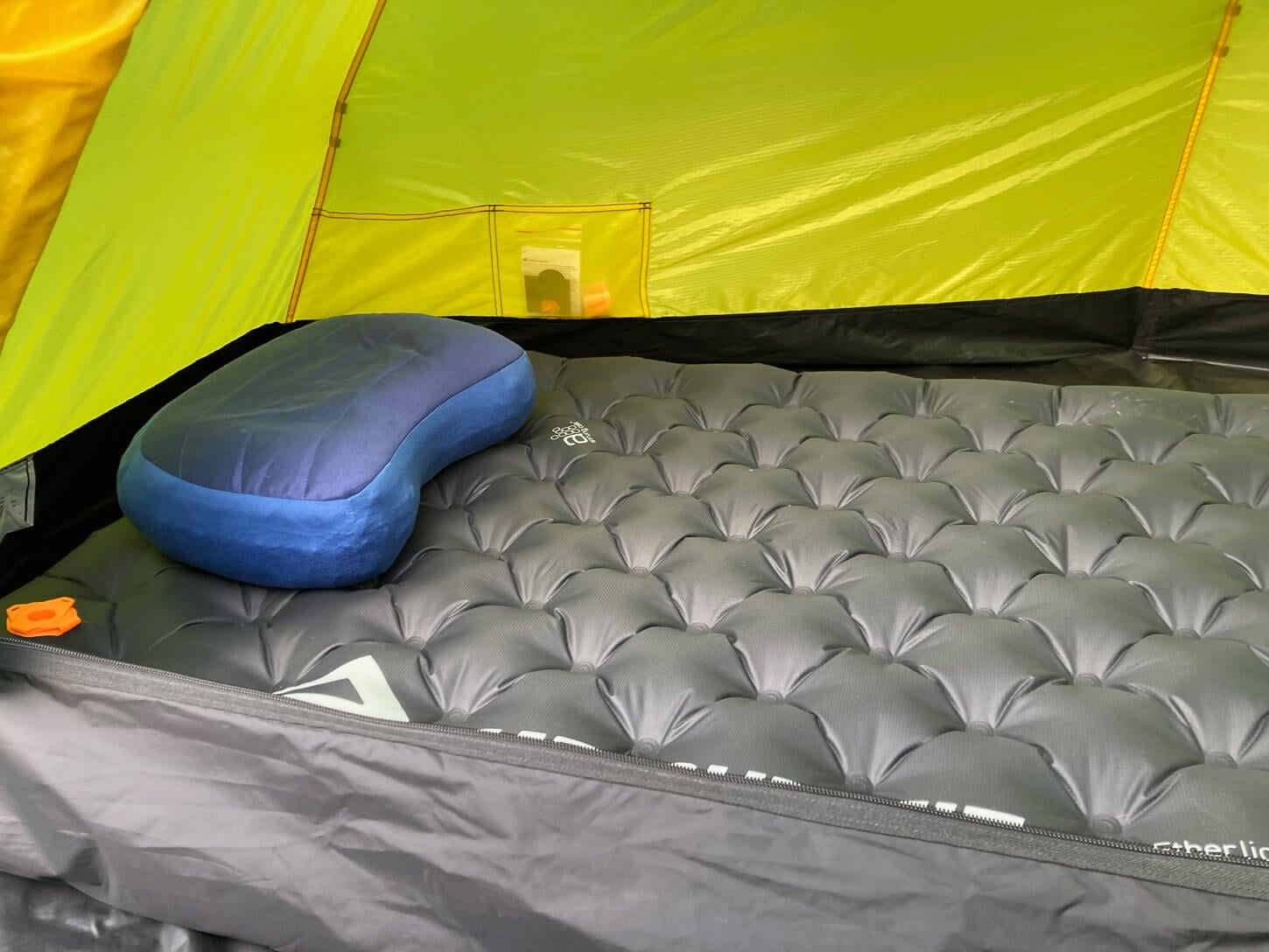 Sleeping pad with a pillow inside the tent.