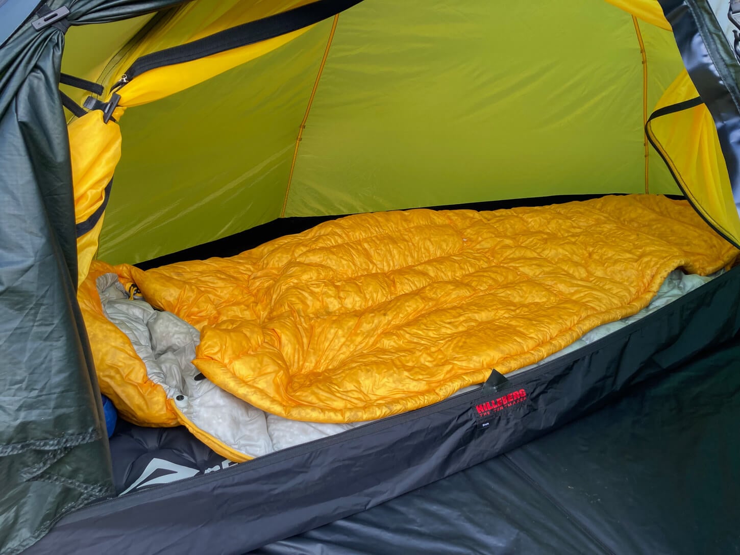 Tent with a sleeping bag inside of it.