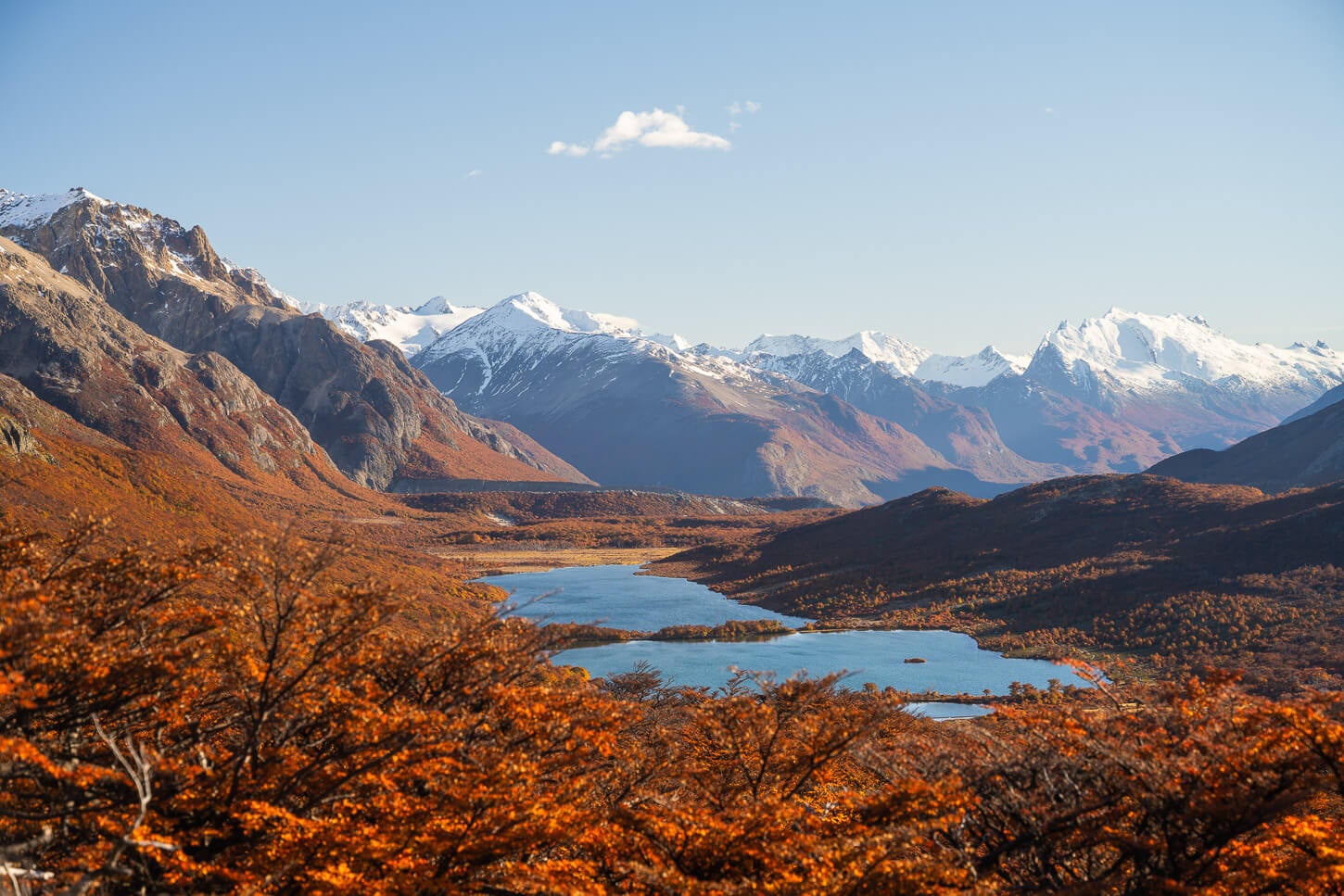 View of Lagunas Mader e HIja from th trail to Loma de las Pizarras, on a sunny autumn day with the beautiful vibrant colors of the lenga trees.