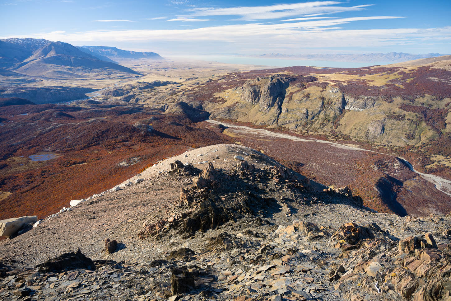 Sweeping view of the landscape around El Chaltén from a nearby mountain, where also Lago Viedma is visible in the distance.