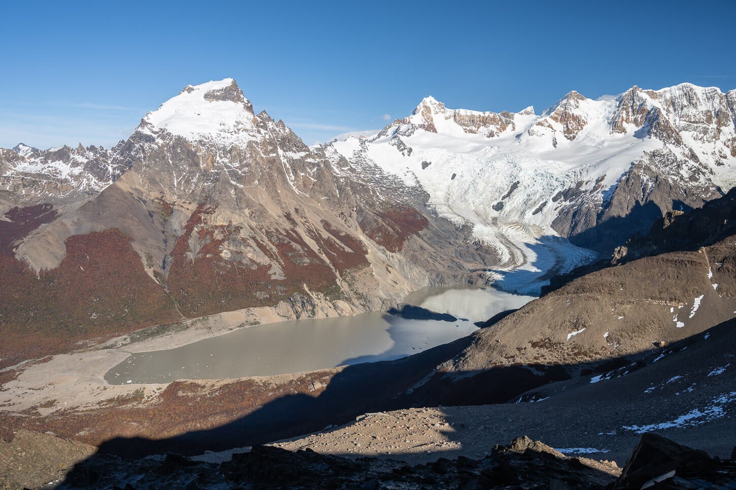 View of Laguna Torres and Grande Glacier from the hiking trail to Loma de las Pizarras, on a clear day with no clouds.