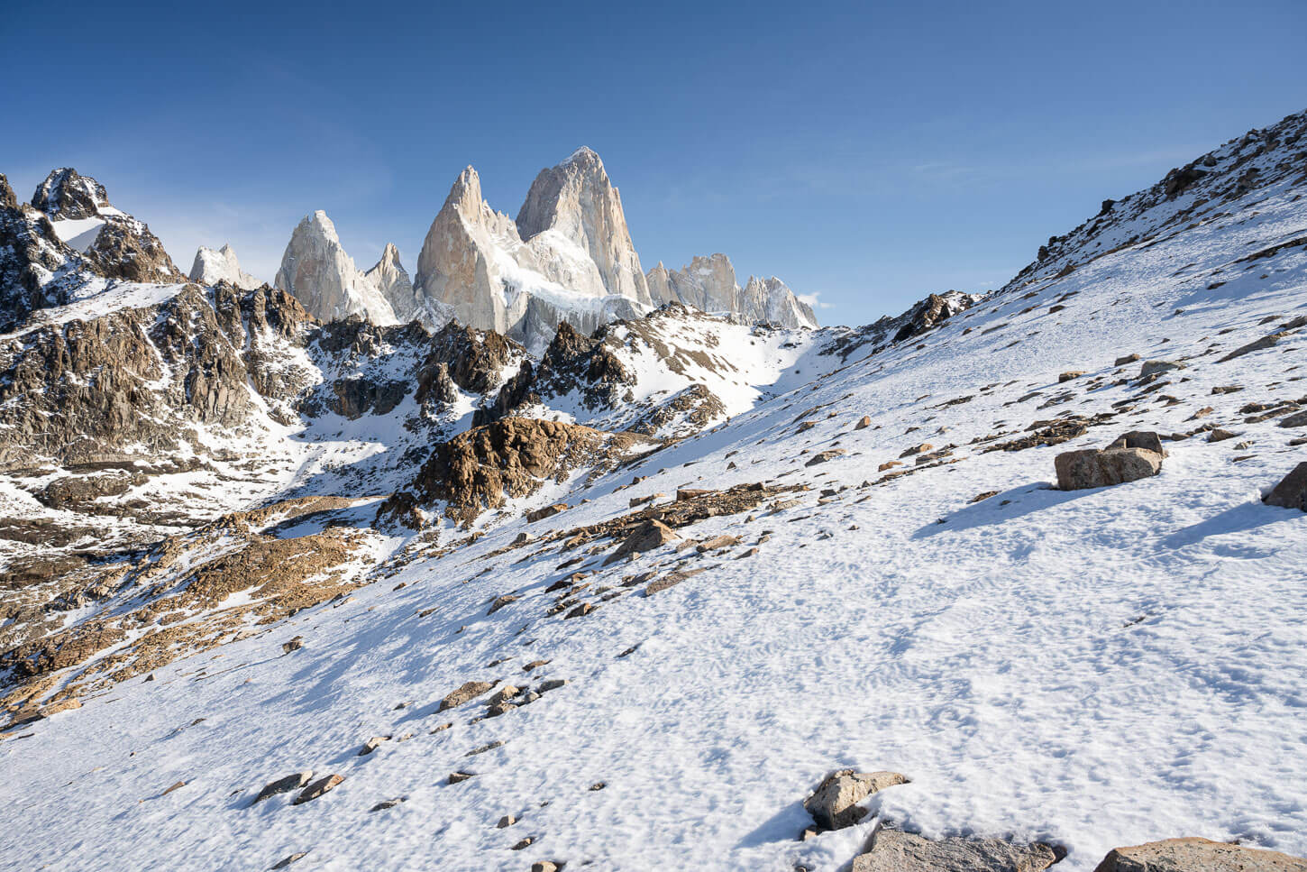 Ice covered slope on Loma de las Pizarras, on a sunny day with blue skies.