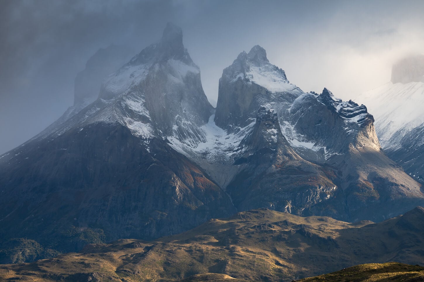 Close up view of the Cuernos in Torres del Paine, with a moody light and equally moody sky.