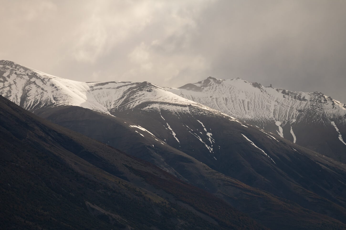 Details if some multi-layered, snow-capped mountains in Torres del Paine.