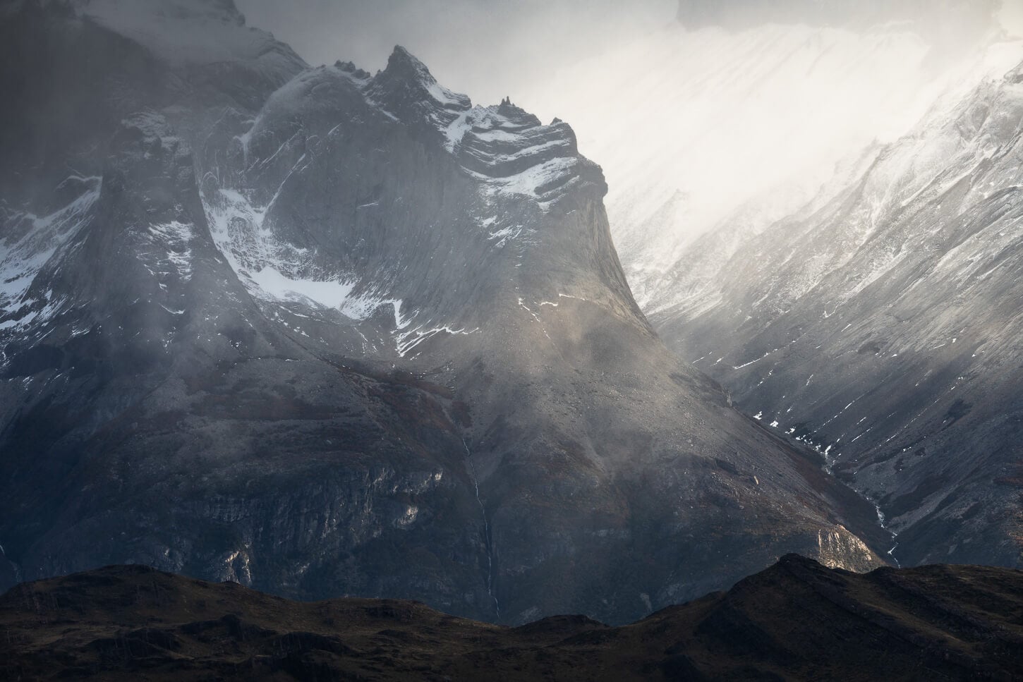 Detail of the Paine massif mountains under a dramatic light.