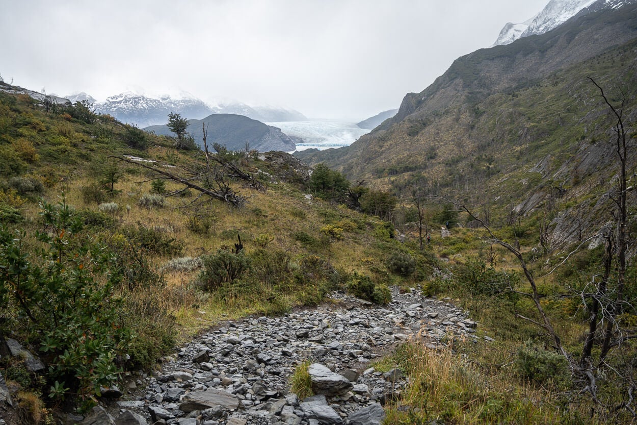 Rocky trail to Refugio Grey, with the glacier still far in the background.