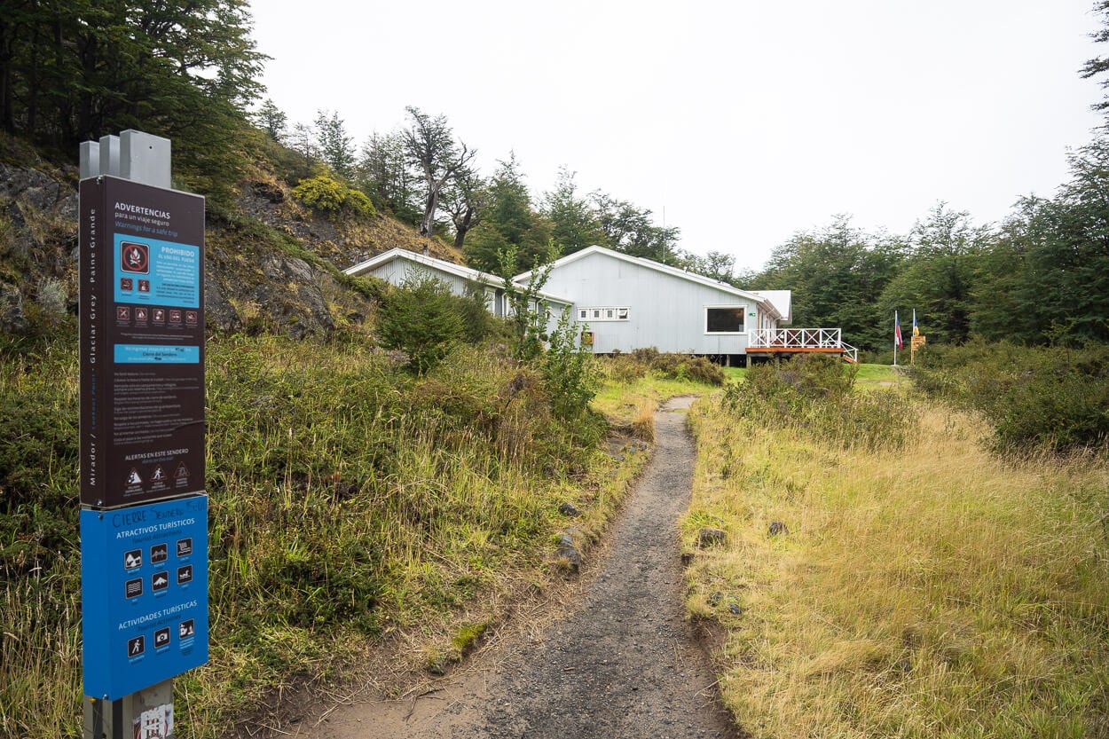 Refugio Grey in Torres del Paine and the welcome sign on a cloudy day.