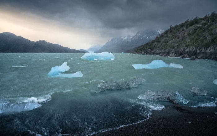 Icebergs in Lago Grey under a dramatic sky, photographed during a hike to Mirador de los Hielos