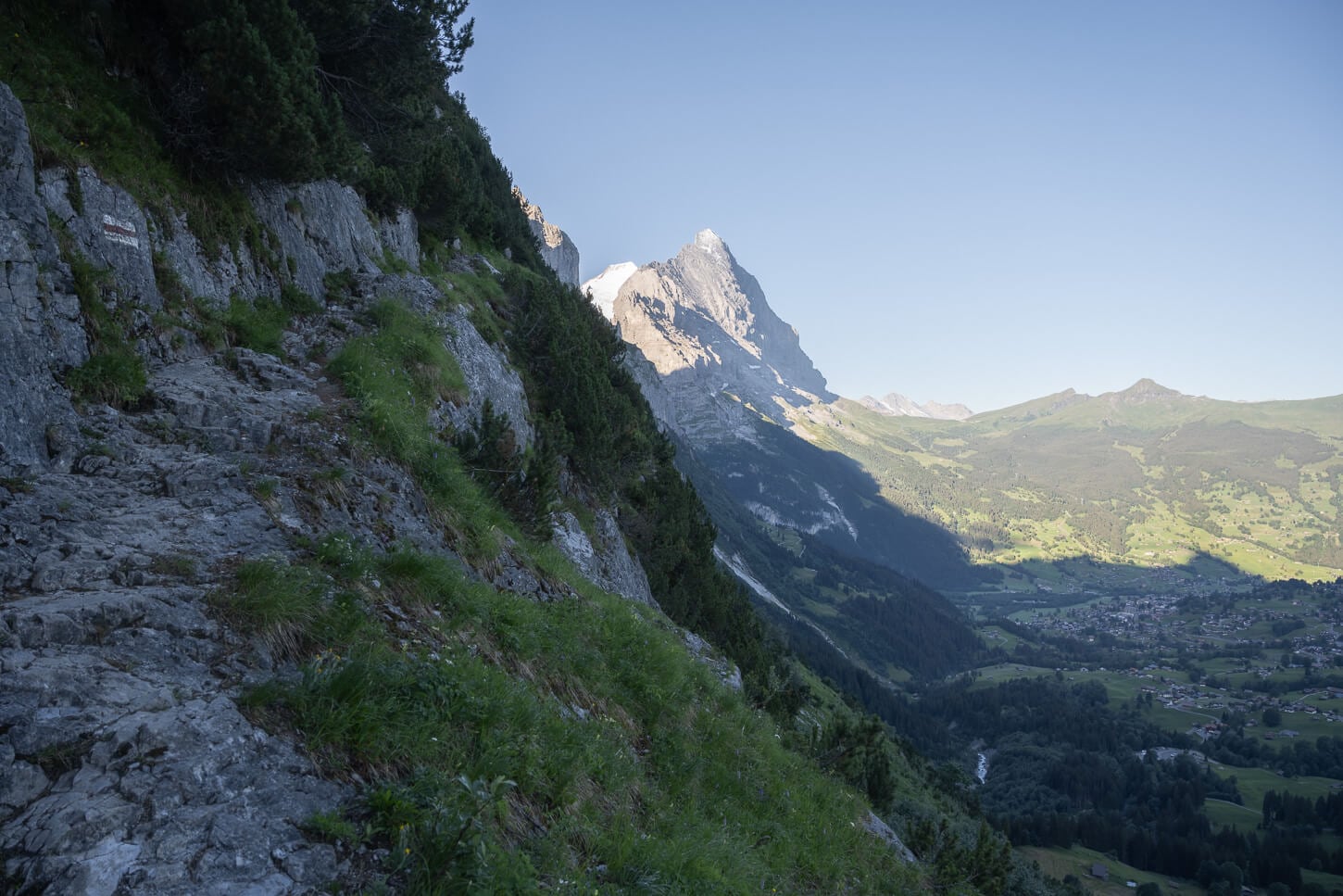 Exposed section of the trail, with a view of the Eiger in the background.