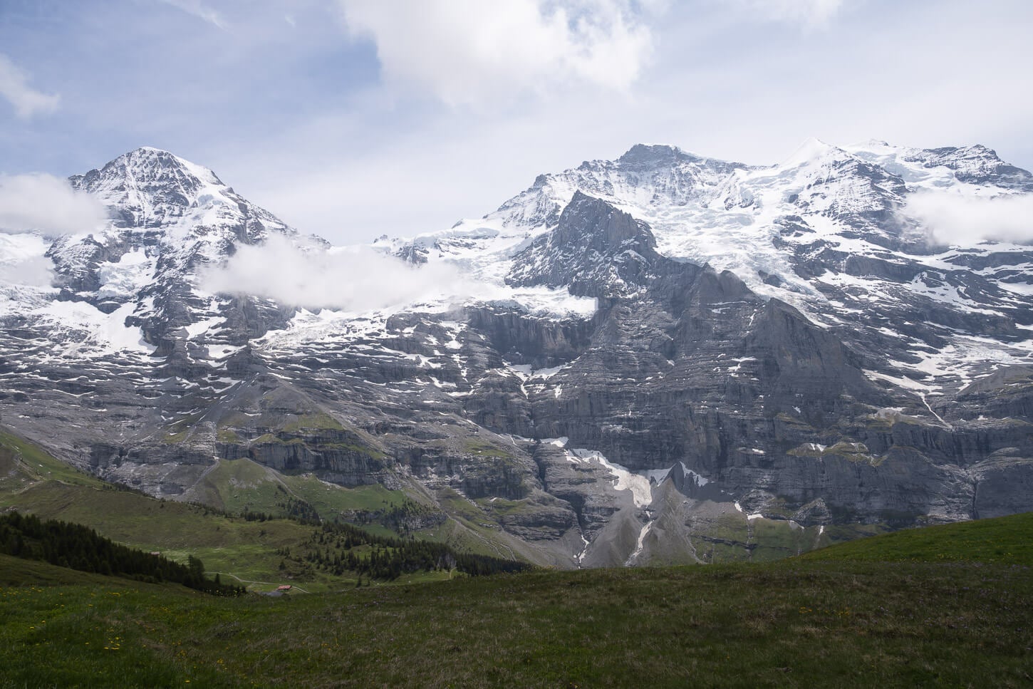 The Mönch and the Jungfrau under a partly cloudy sky