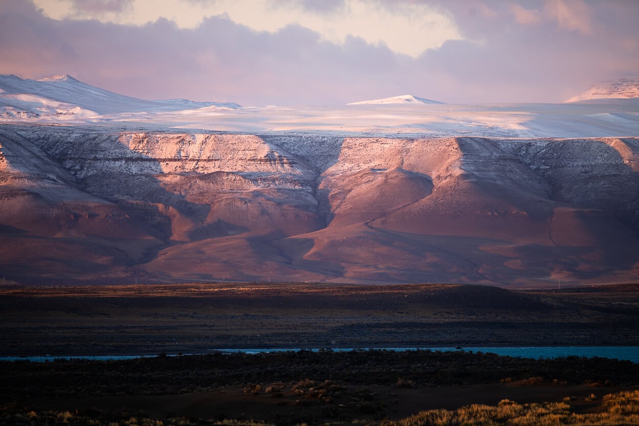 Sunrise over a landscape with a light dust of snow in it, in the Patagonian Autumn