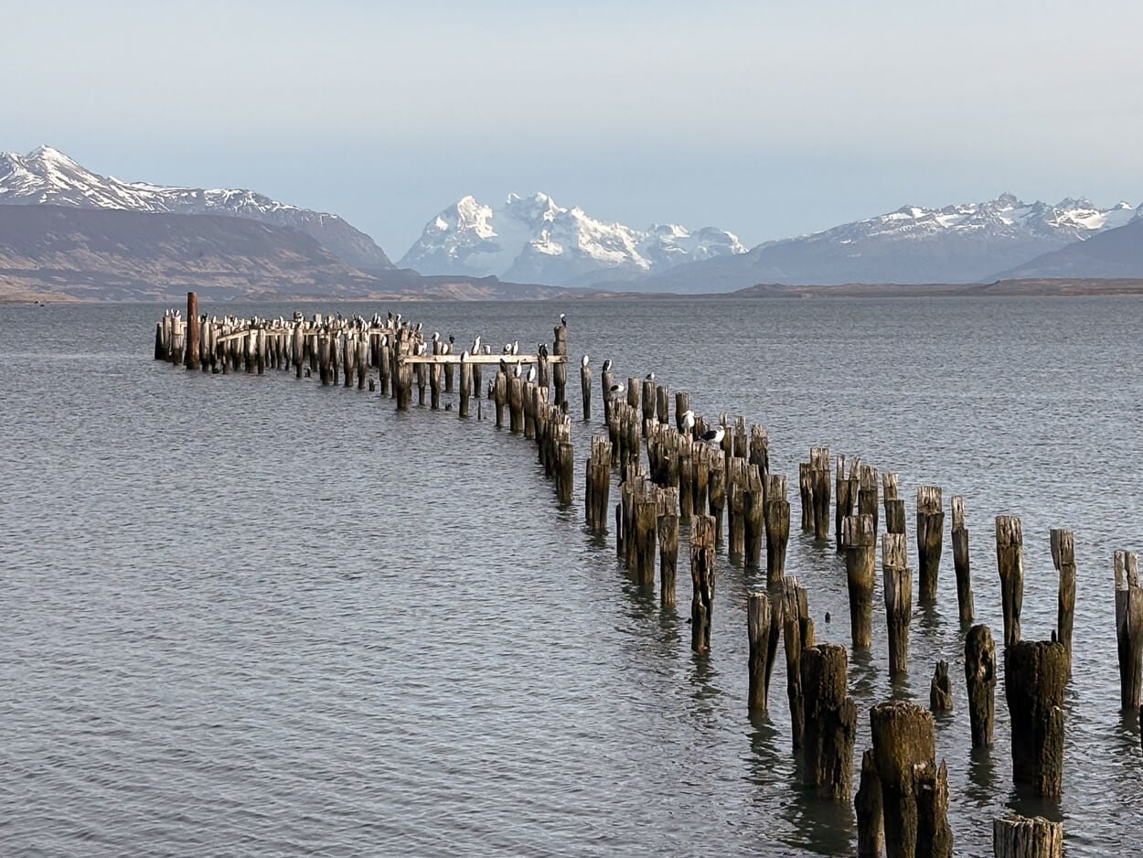 Seascape image in Chile with a view of distant mountains and glaciers.