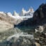 View of Laguna Sucia at the end of the hike, where the mountain Fitz Roy reflects in the waters of the lake on a sunny day with blue skies.
