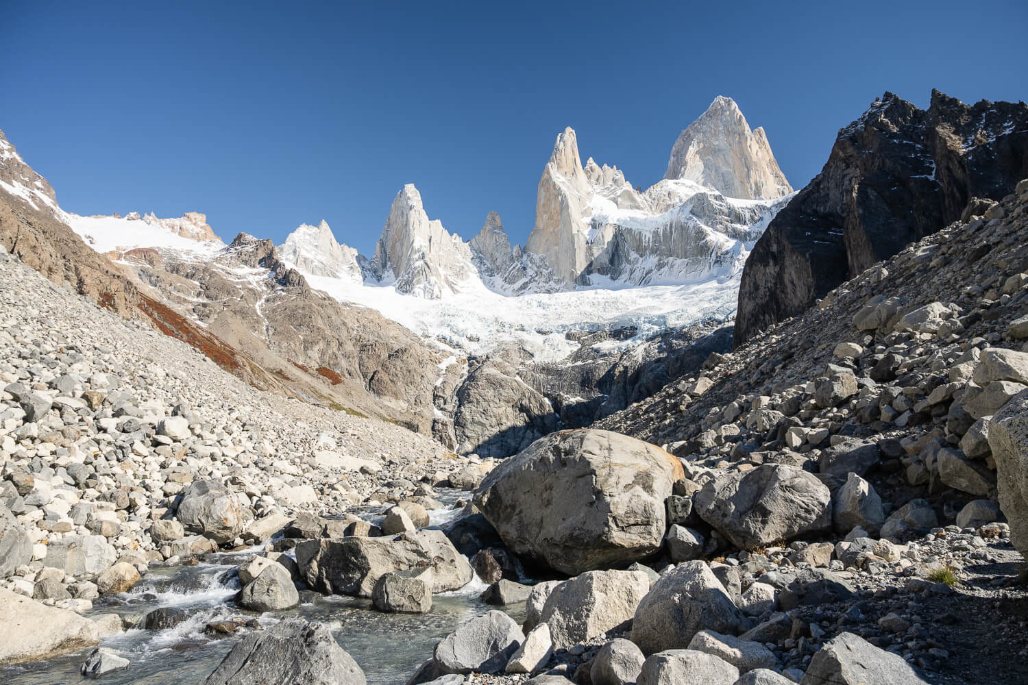 View of a rugged landscape near Laguna Sucia, with mount Fitz Roy in the background.