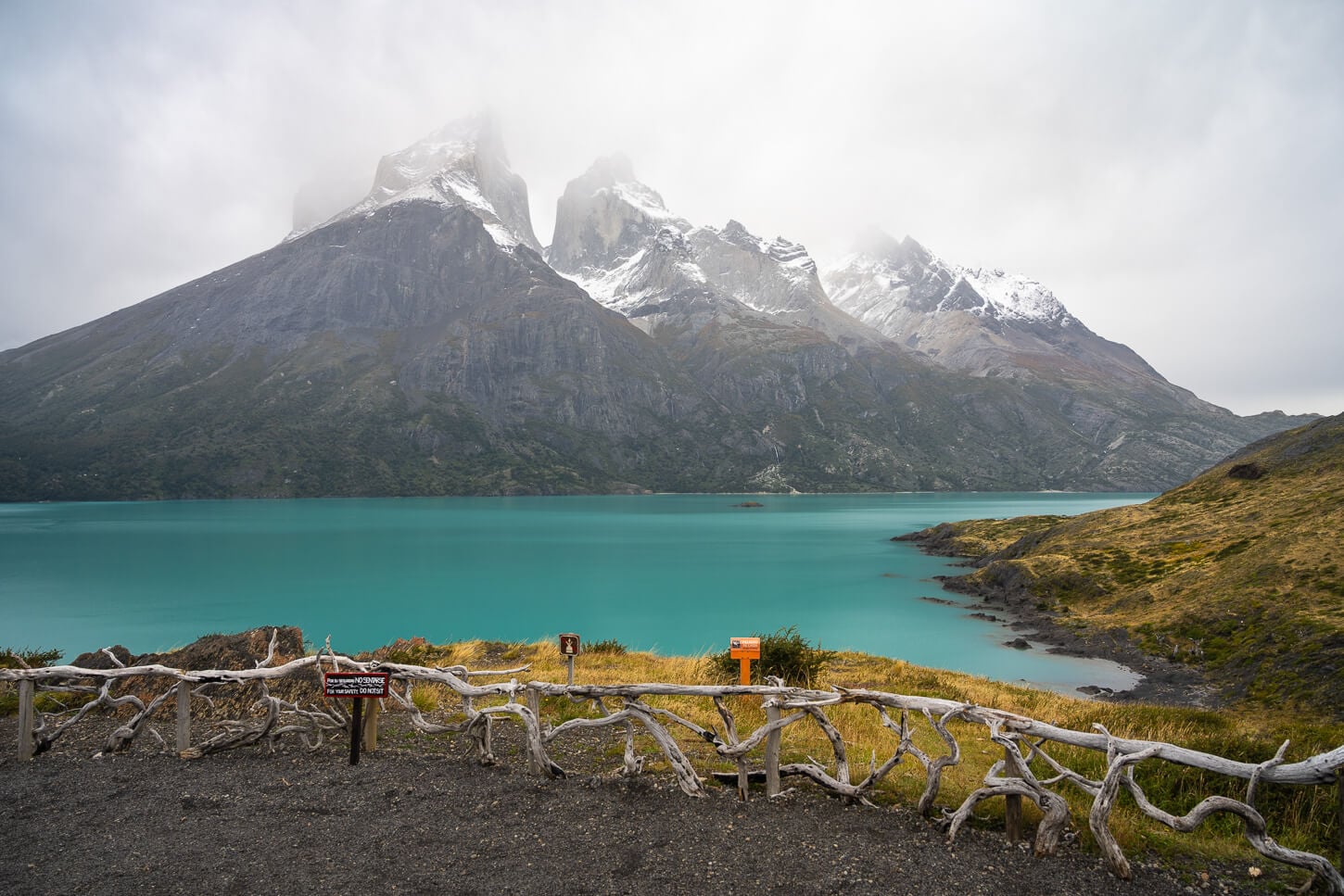View from Mirador Cuernos at the end of the hiking trail with the blue waters of Lake Nordenskjöld just below the Cuervo el Paine