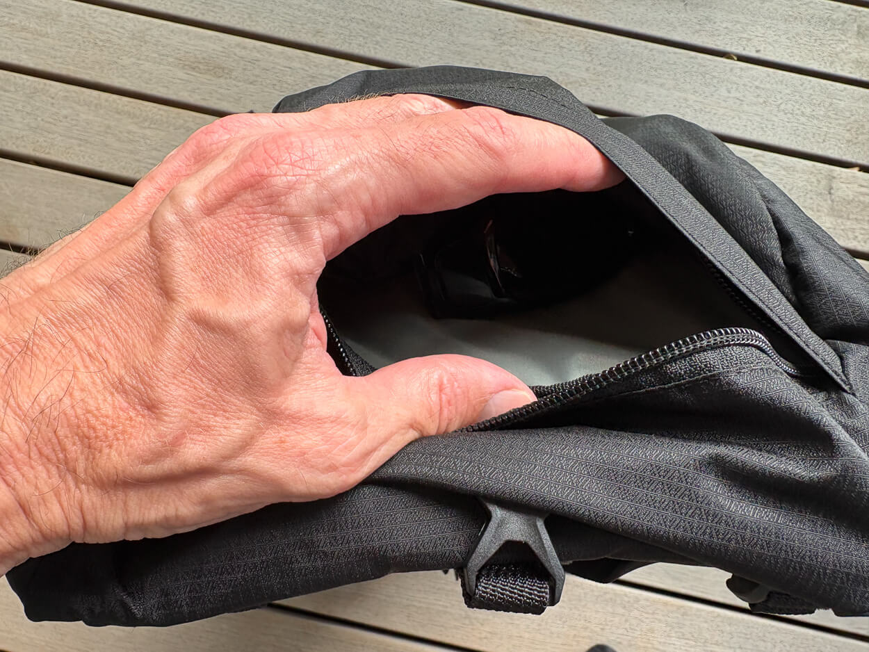 Top lid of a backpack opened.
