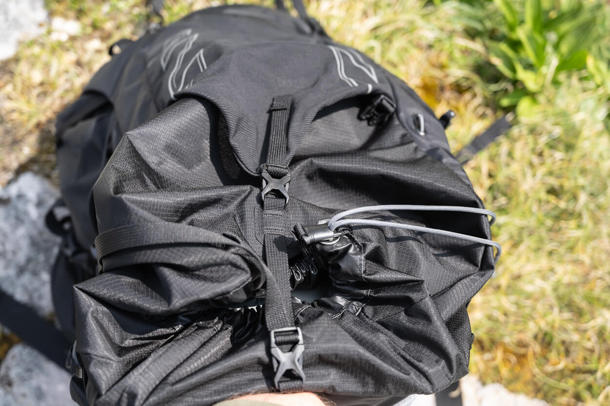 View from above of an Osprey Talon 44 showing the drawcord on the side of the pack.