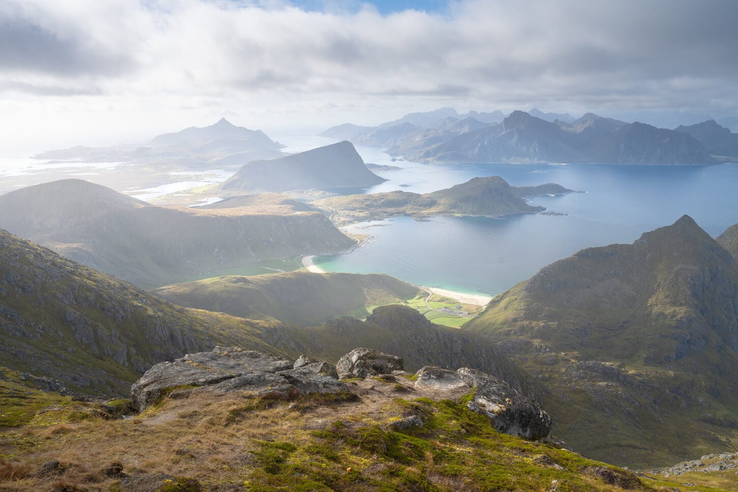 One of the best viewpoints on the Hike to Himmletinden, with stunning views of the mountains in the southern part of the archipelago under a soft, warm light
