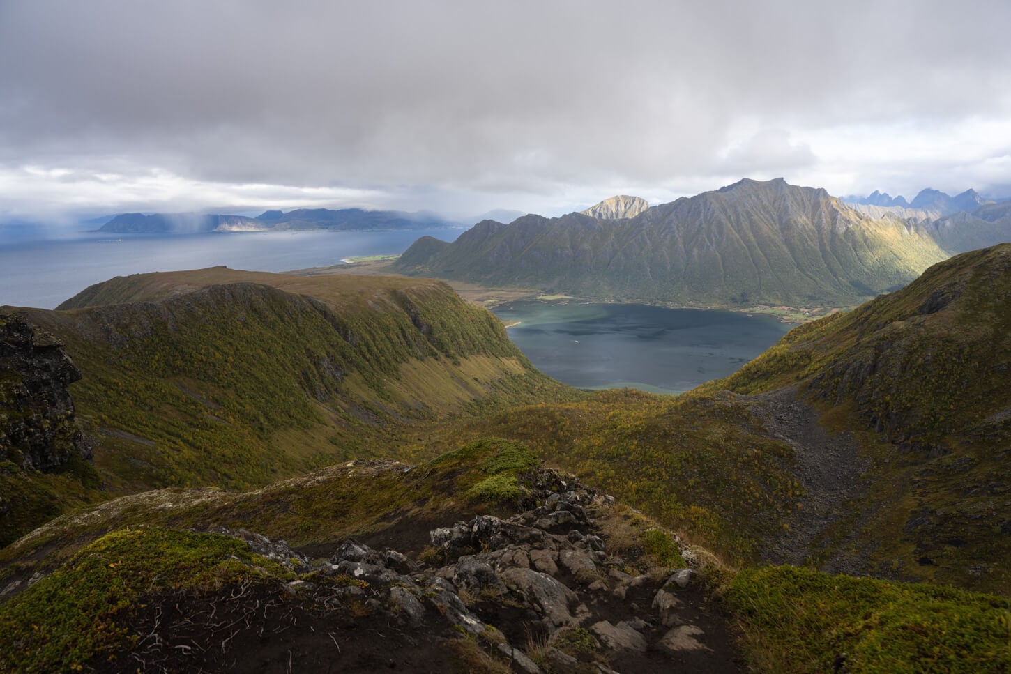View of the landscape and mountains from the Matmora Hiking trail, with the ocean in the far sitance and the mountains in the foreground.